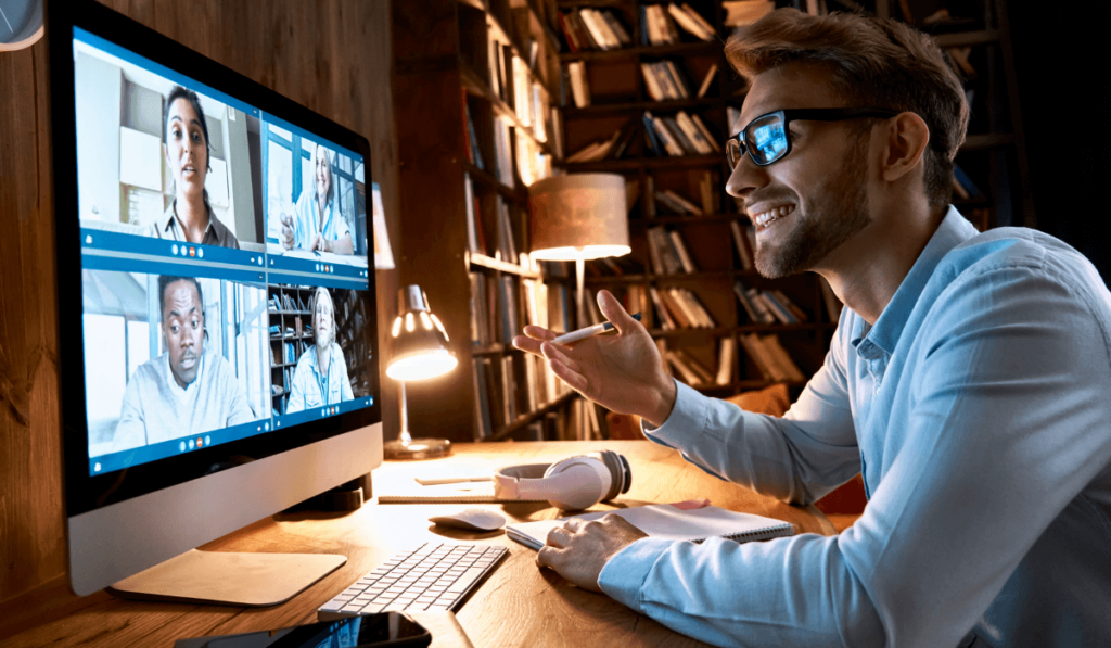 Manager talking to hybrid workforce on a video call