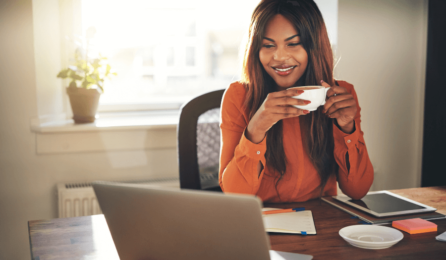 Woman looking at laptop screen from home office