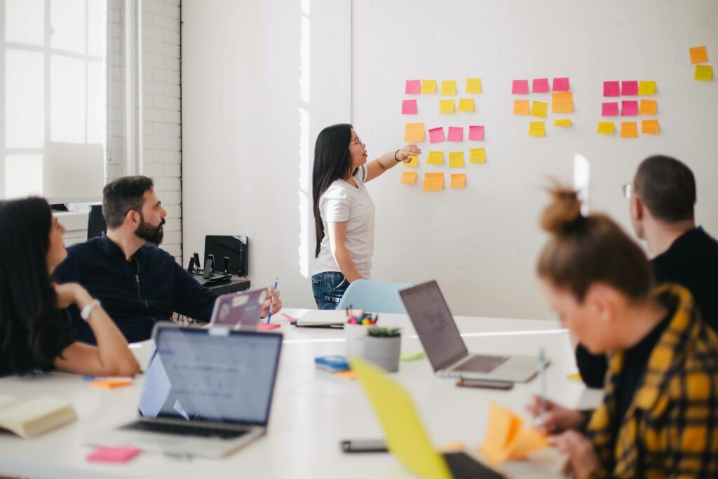 meeting with sticky notes on wall