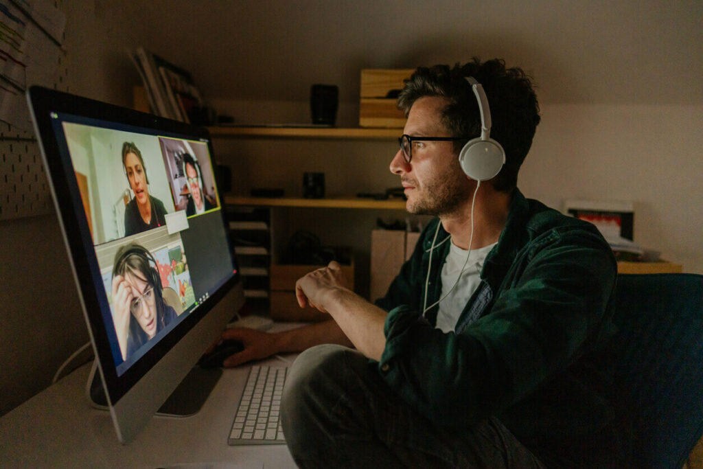 Man having a video conference call with colleagues