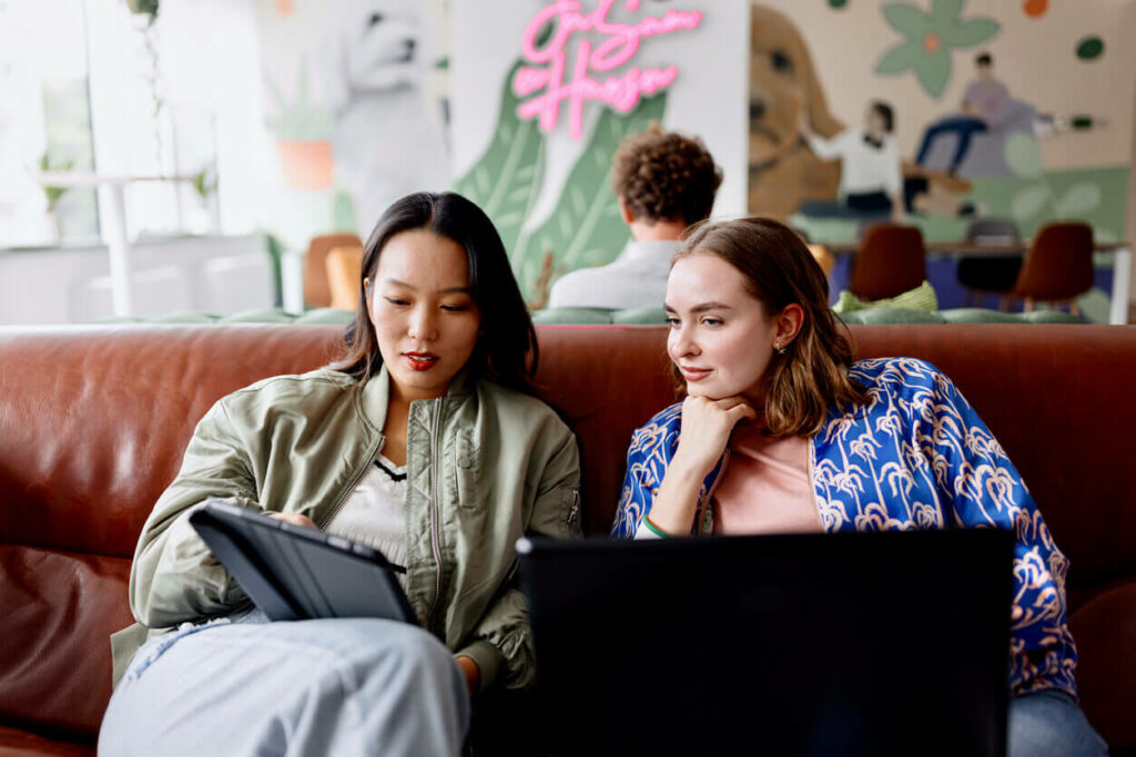 Two businesswomen working together in a modern office