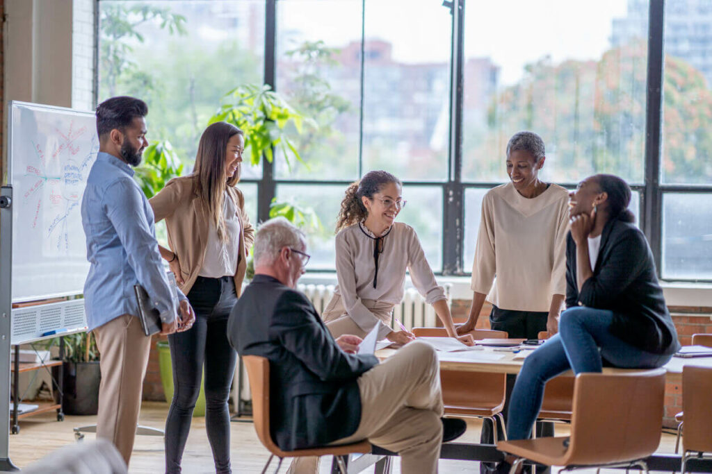 Group of employees talking together in the office