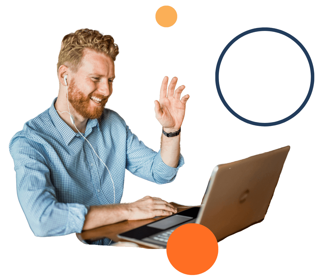 Man waving at computer screen